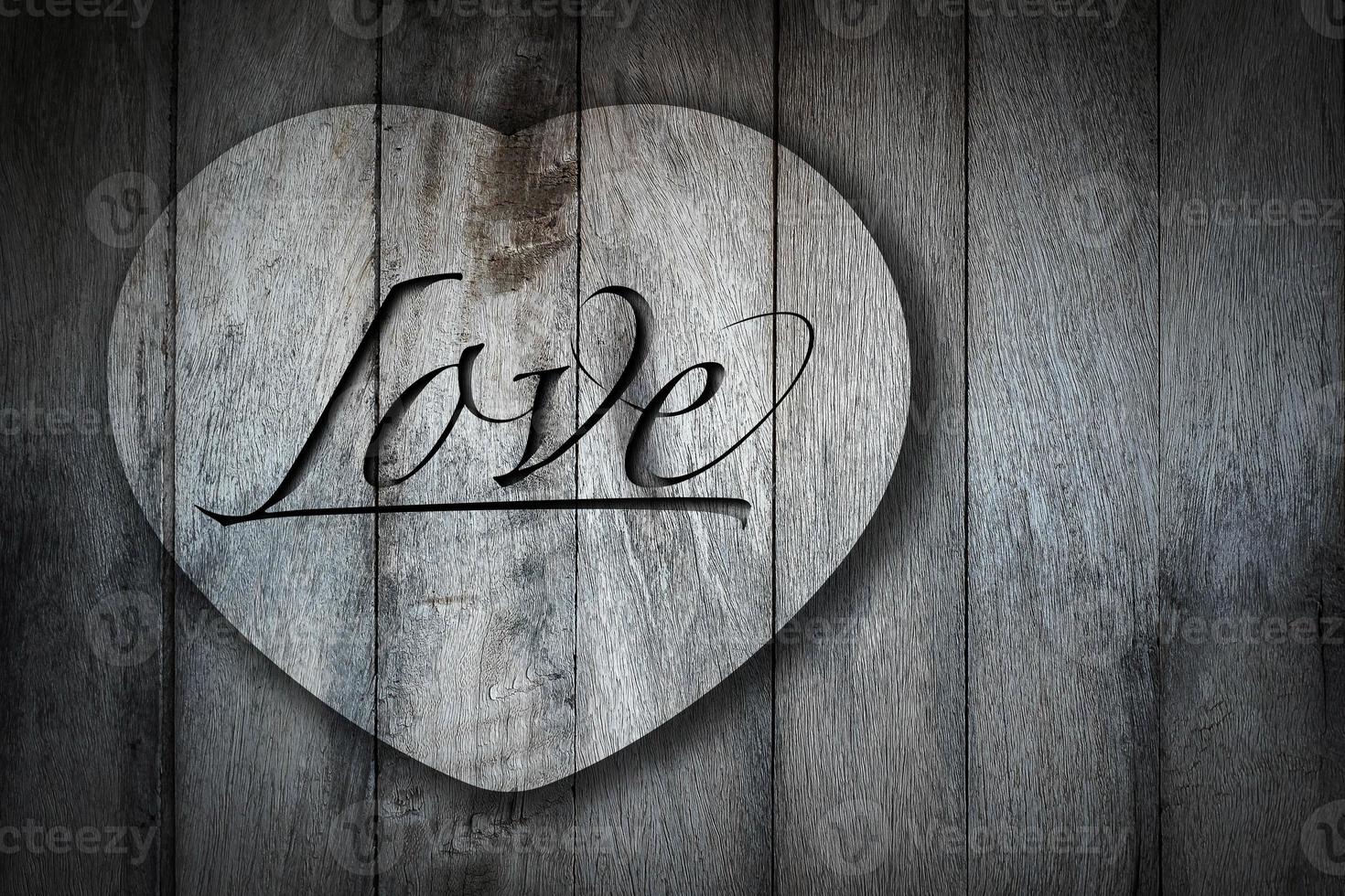 heart shape on old wooden background. photo