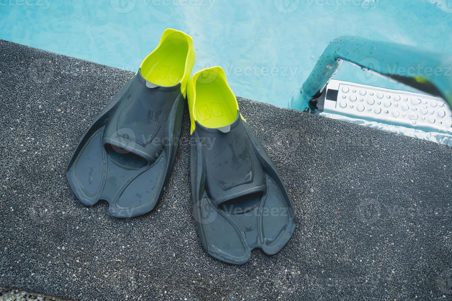 Mask and flippers in a swimming pool. Swim items Masks and fins Sports accessories for swimming. Underwater masks and flippers photo