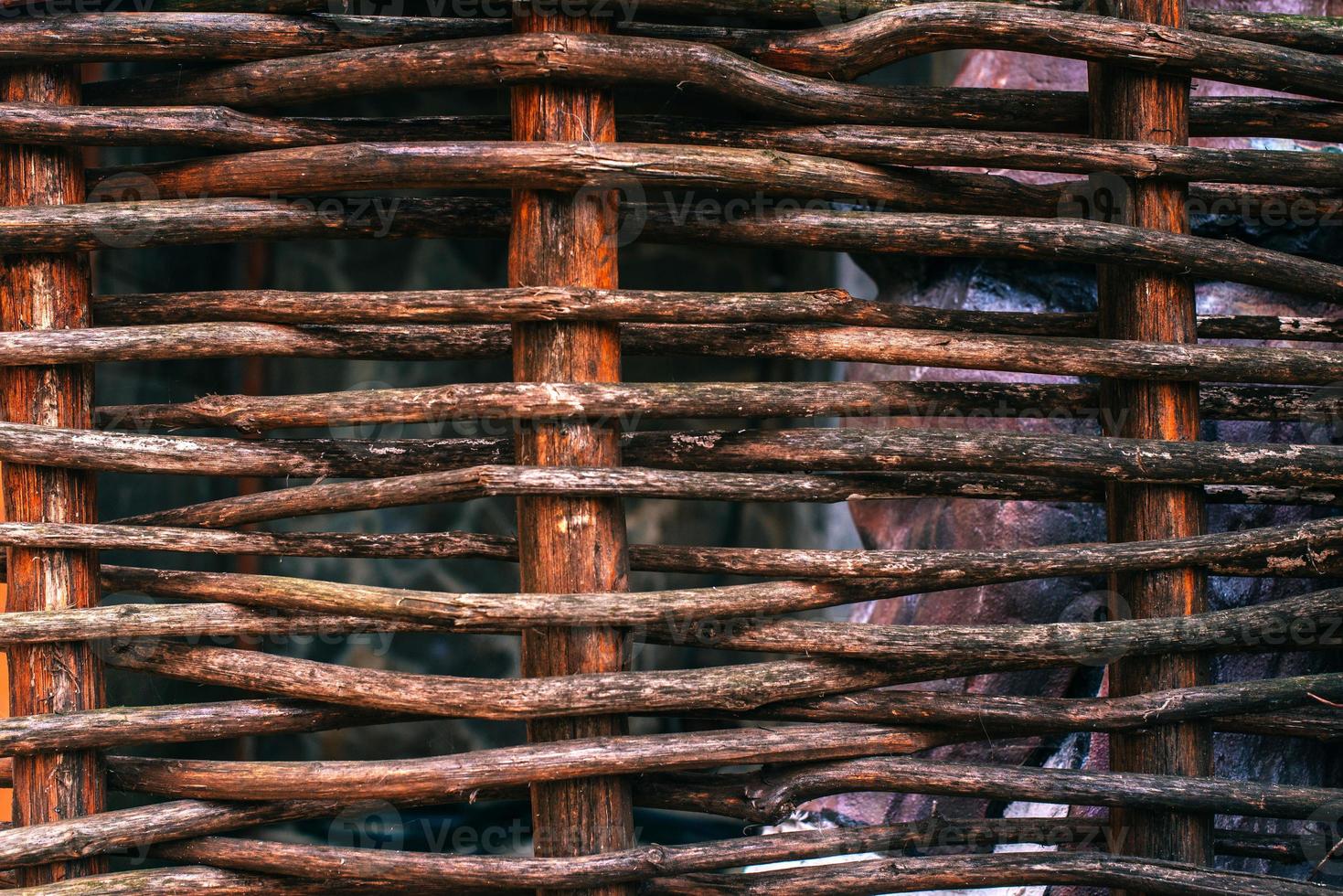 Wickerwork woven background texture of wood photo