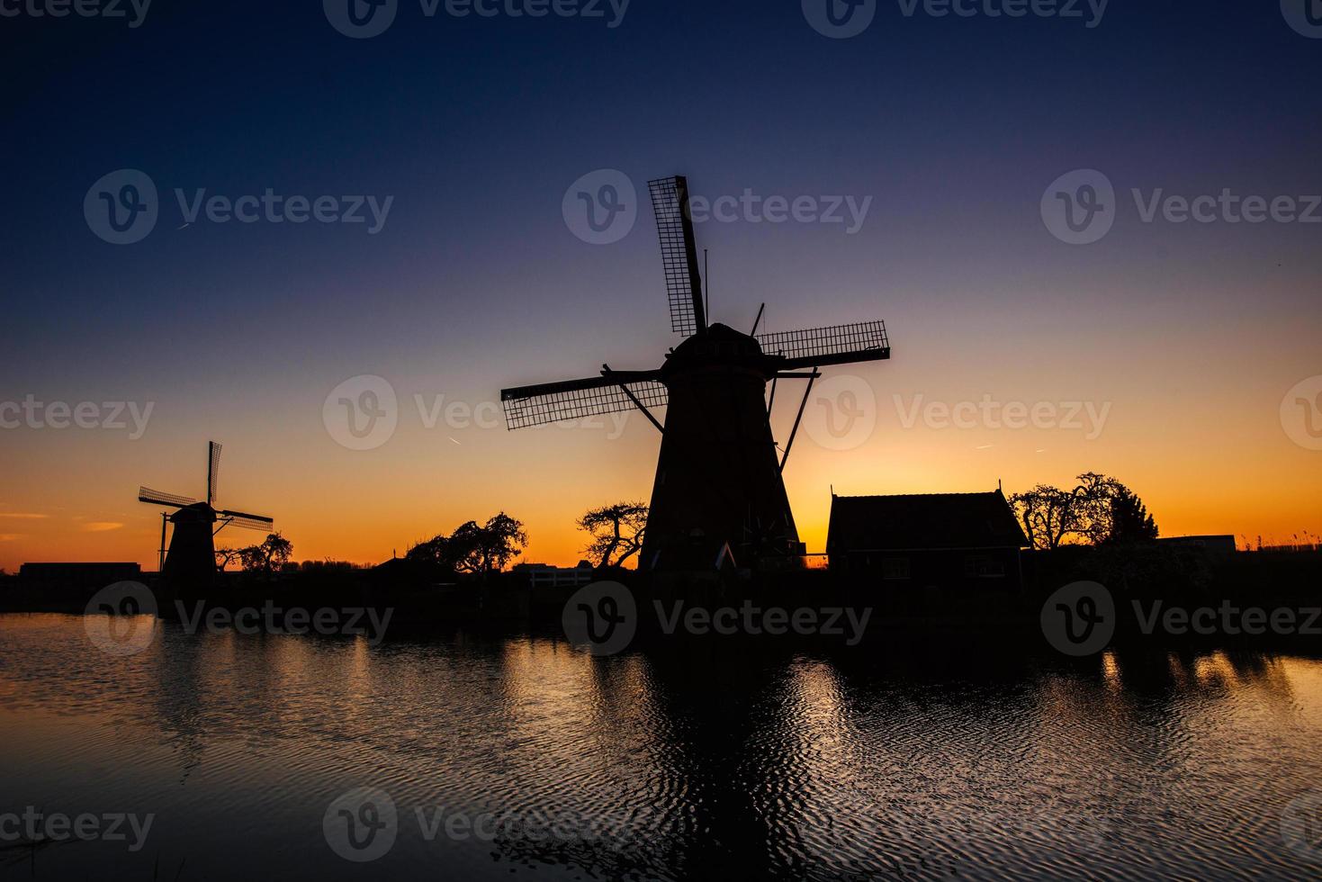 Starry sky over Dutch mills. photo