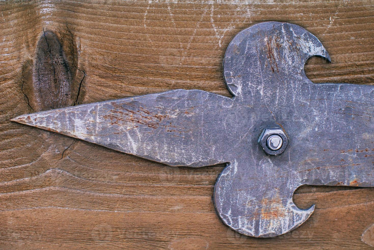 forged parts on old wooden surfaces photo