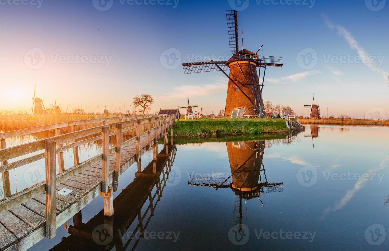 Traditional Dutch windmills from the channel Rotterdam. photo