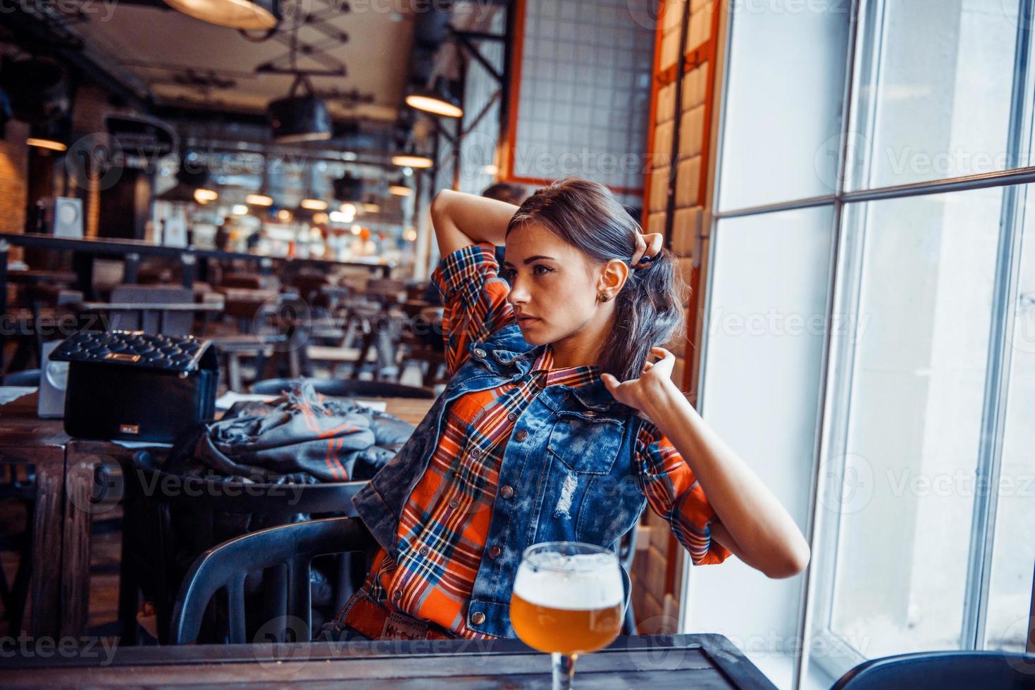 Beer woman enjoying a fresh draft  on cafe. Art processing photo