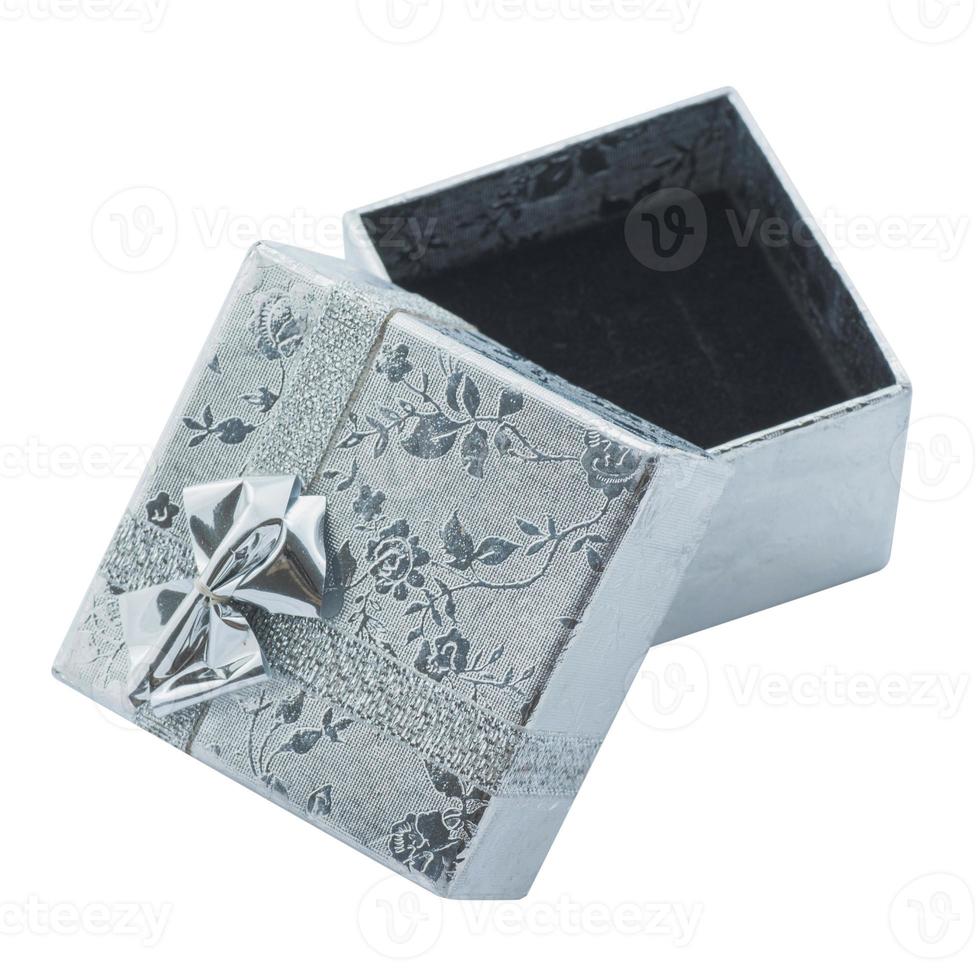 Gift box with silver ribbon bow isolated on white photo