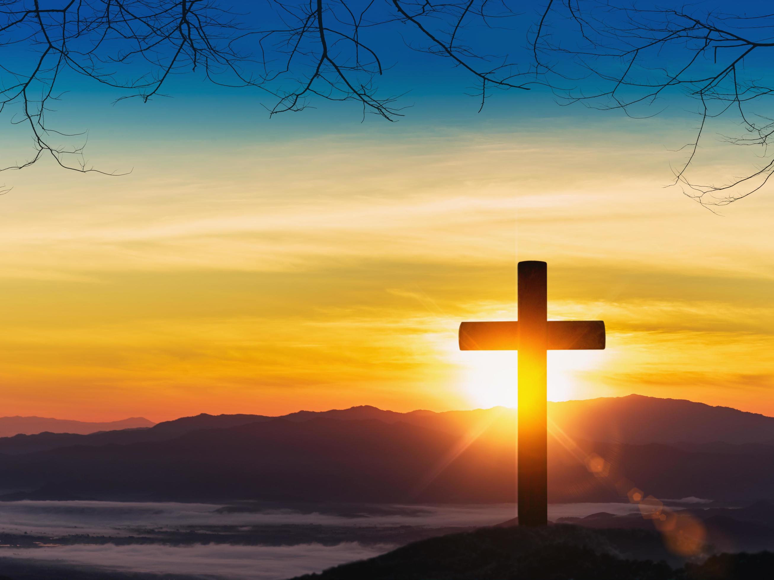 Silhouette of cross on mountain sunset background. 6696515 Stock Photo