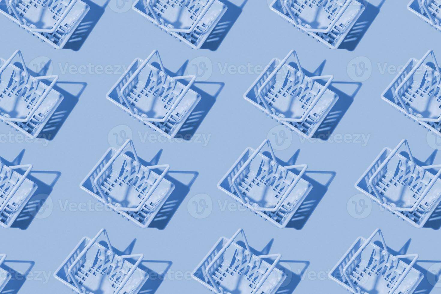 Pattern with shopping basket monochrome blue color. Minimalism. Sales, shopping, prices concept. photo