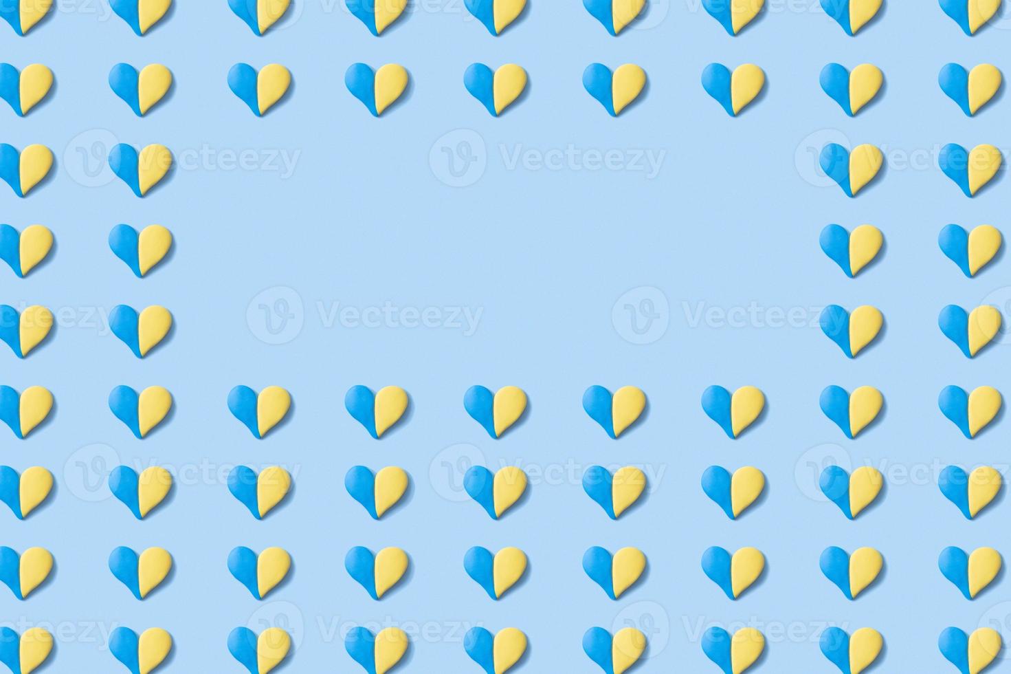 Pattern with many hearts shape of yellow-blue colors of the Ukrainian flag with copy space photo