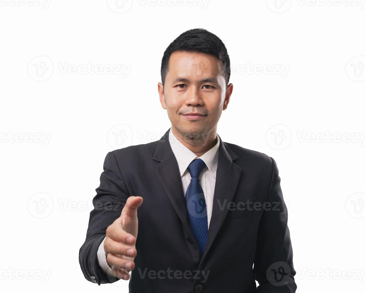 Asian business man wearing suit offering a handshake and smiling on isolated white background. Business concept asian man want to offering handshake. photo