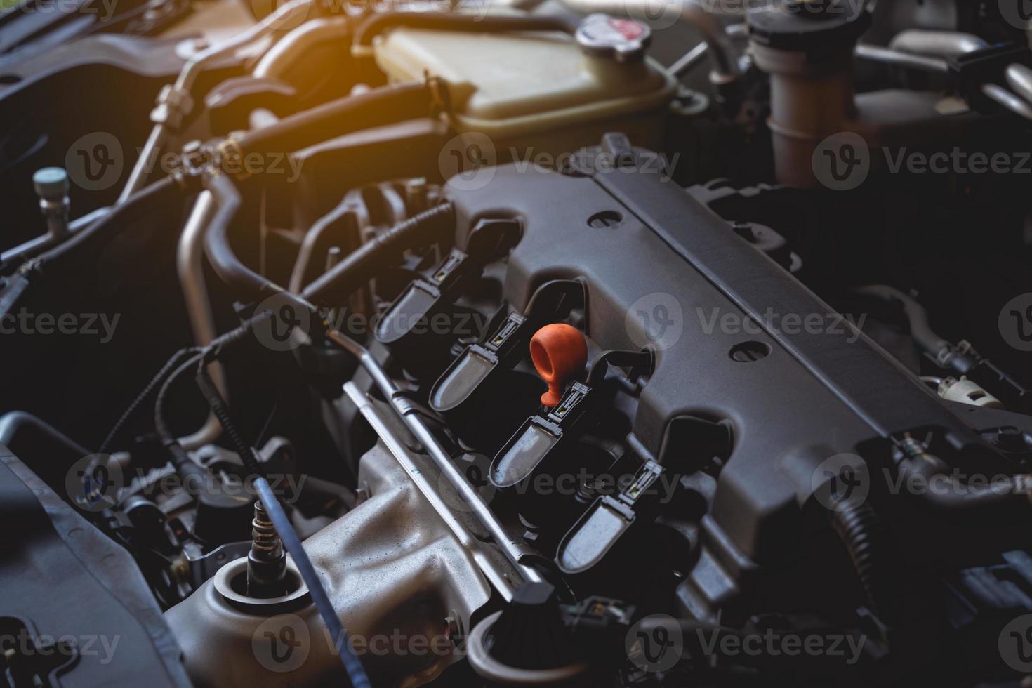 Under the hood of sports car. Powerful engine closeup. Close up detail of new car engine.Clean motor block. photo