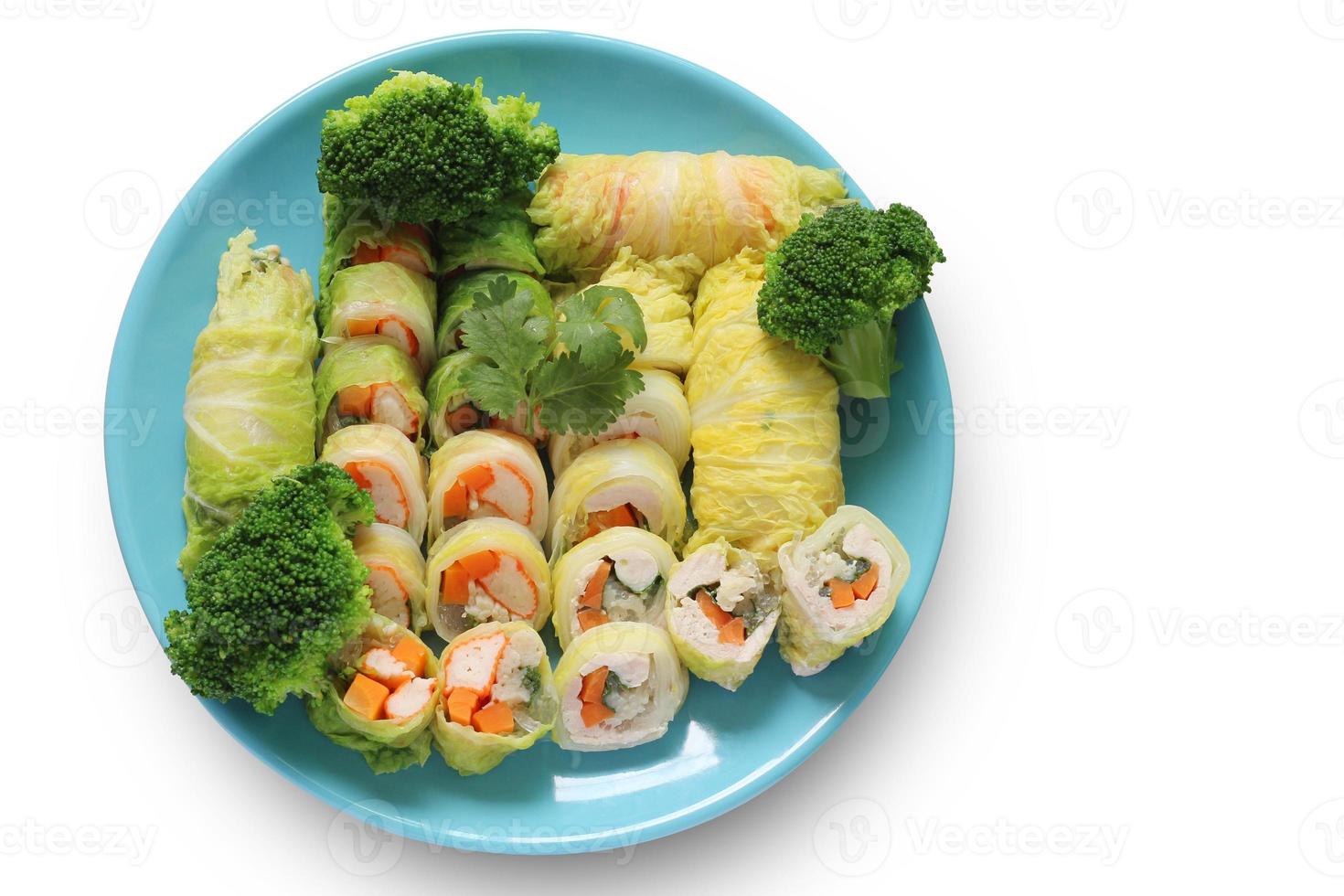 Vegetable Roll, Minced Pork, Crab Stick, Chicken with Broccoli in Blue Plate isolated on white background with clipping path. Salad rolls. Top view of healthy food. photo