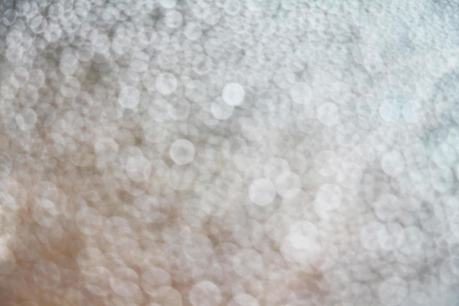 Blurry of water drops on the window glass. Abstract background of blurred raindrops. photo