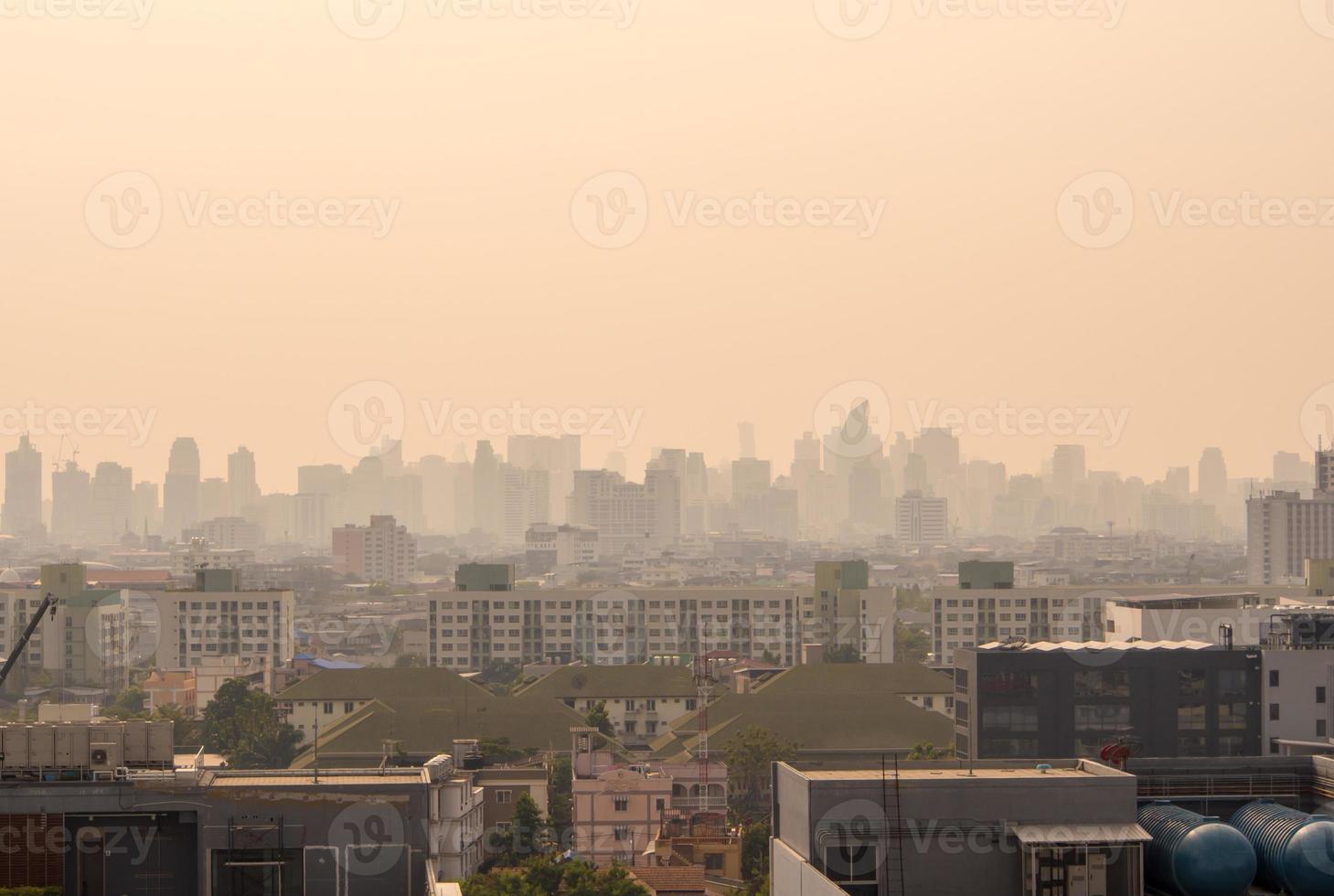 Bangkok downtown cityscape urban skyline in the mist or smog. Bangkok city in the soft light photo