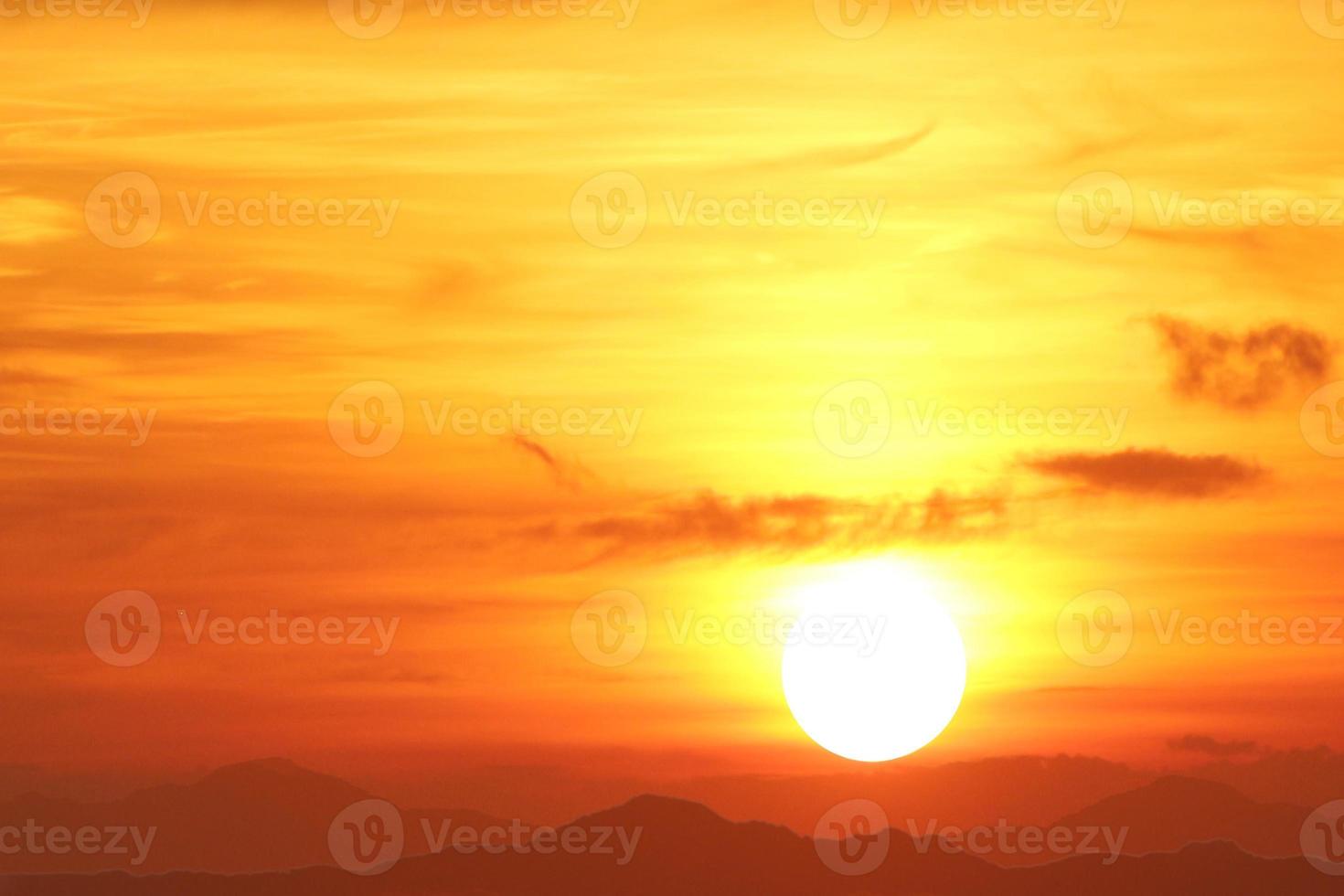 Sunset over the mountains with a beautiful golden sky. photo