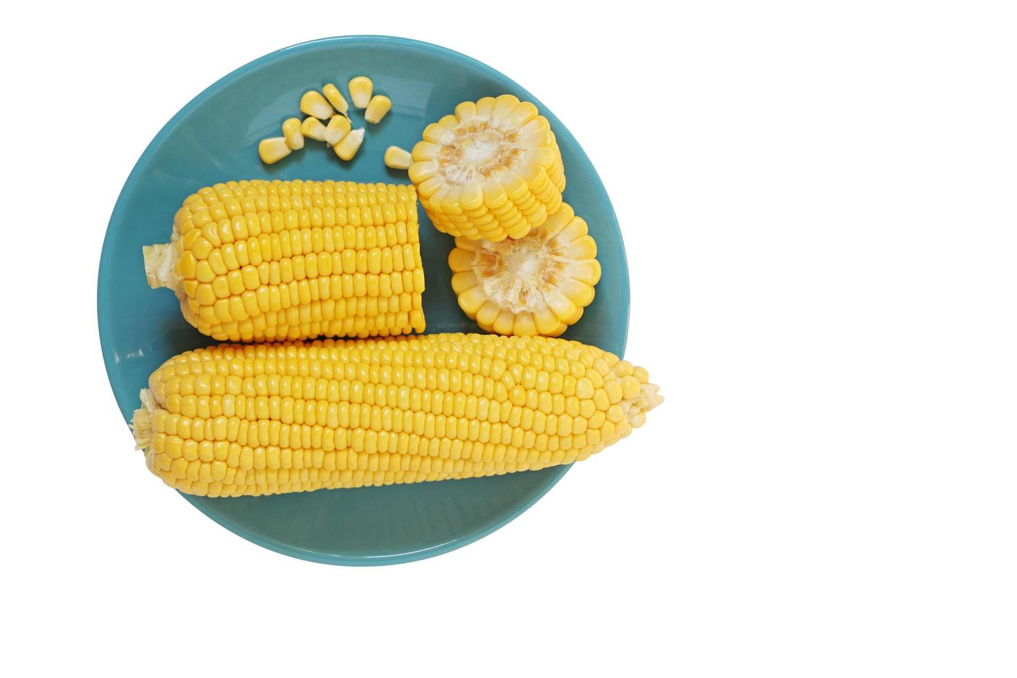 Fresh organic corn in plate and isolated on white background with clipping path. photo