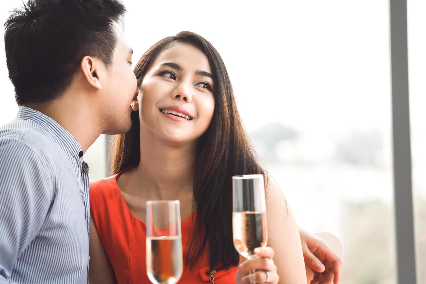 Adult asian lover couple man and woman hand hold a champagne. photo