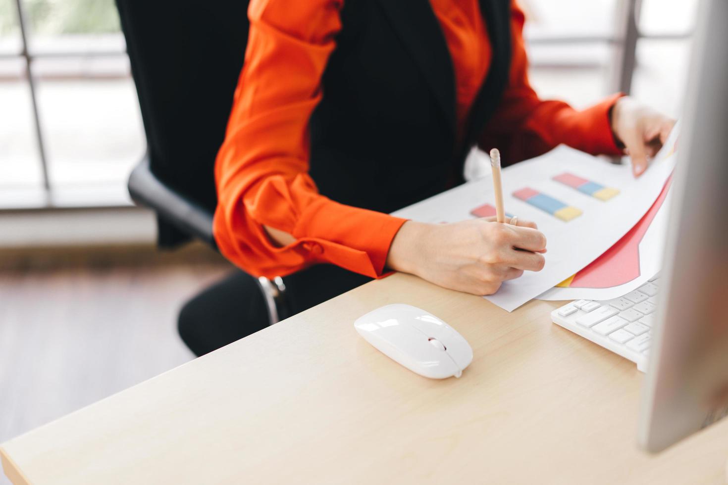 Closeup of busy business women hand writing on paper photo