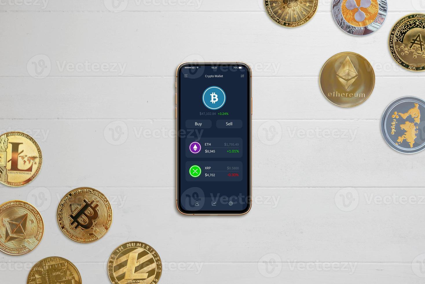 Phone with crypto wallet app concept on desk surrounded by crypto coins photo