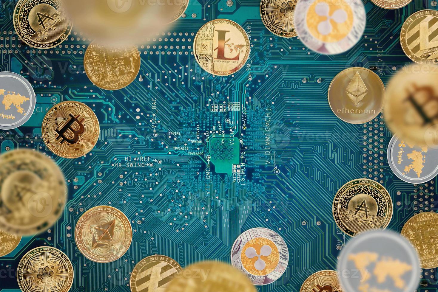 Crypto coins on electronic circuit board. Digiral cryptocurrency concept photo