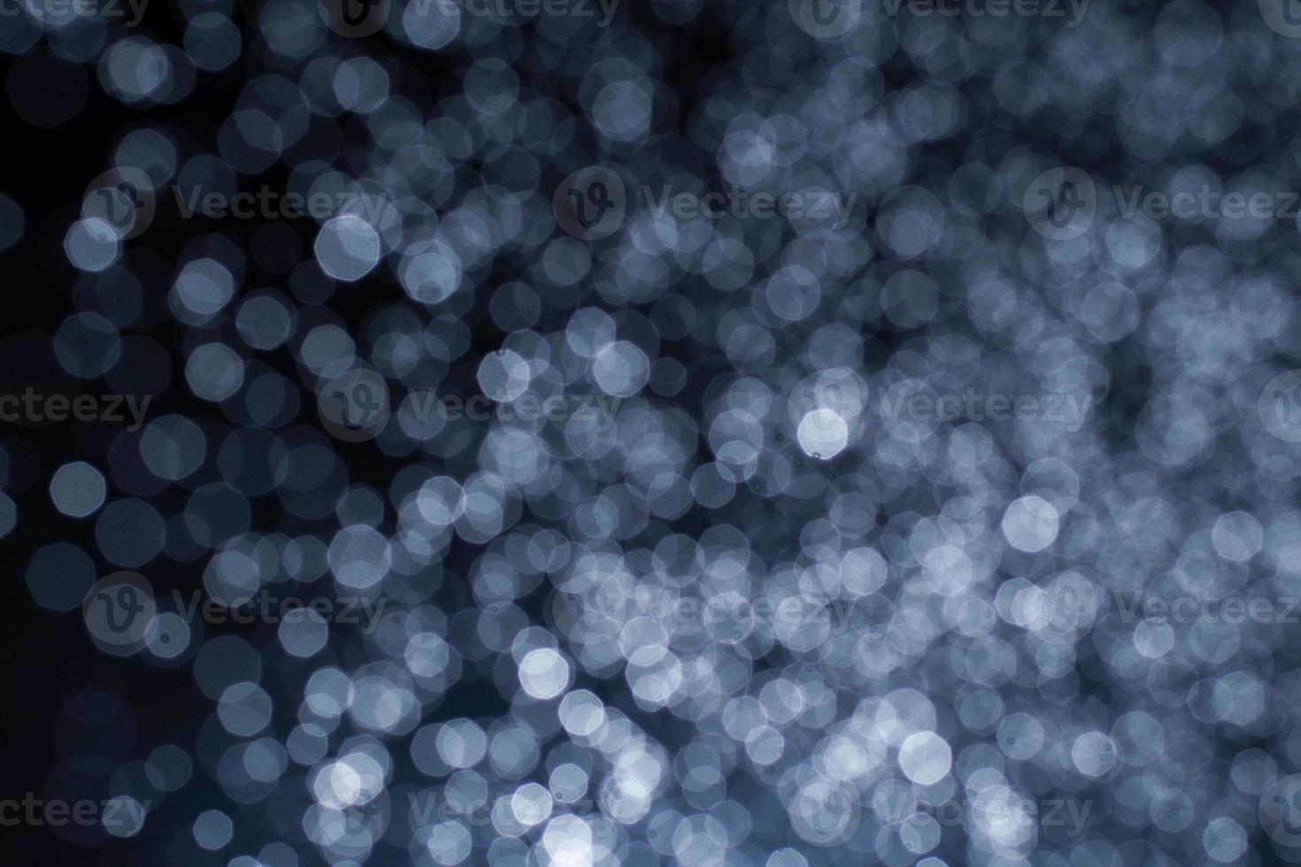 Dark blue abstract background with bokeh. photo