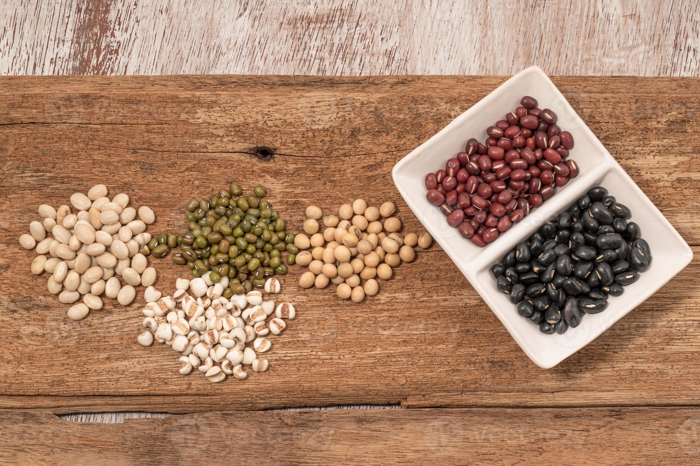 Mix pulse bean on wood background. 6704121 Stock Photo at Vecteezy