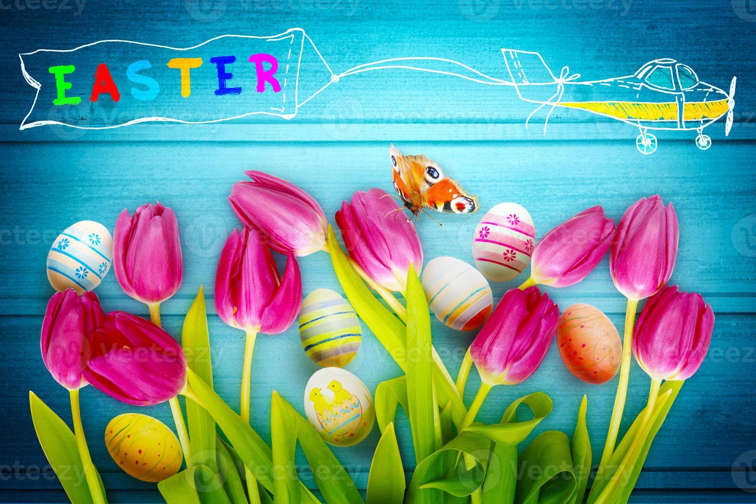 Easter background with colorful easter eggs on wooden background. photo