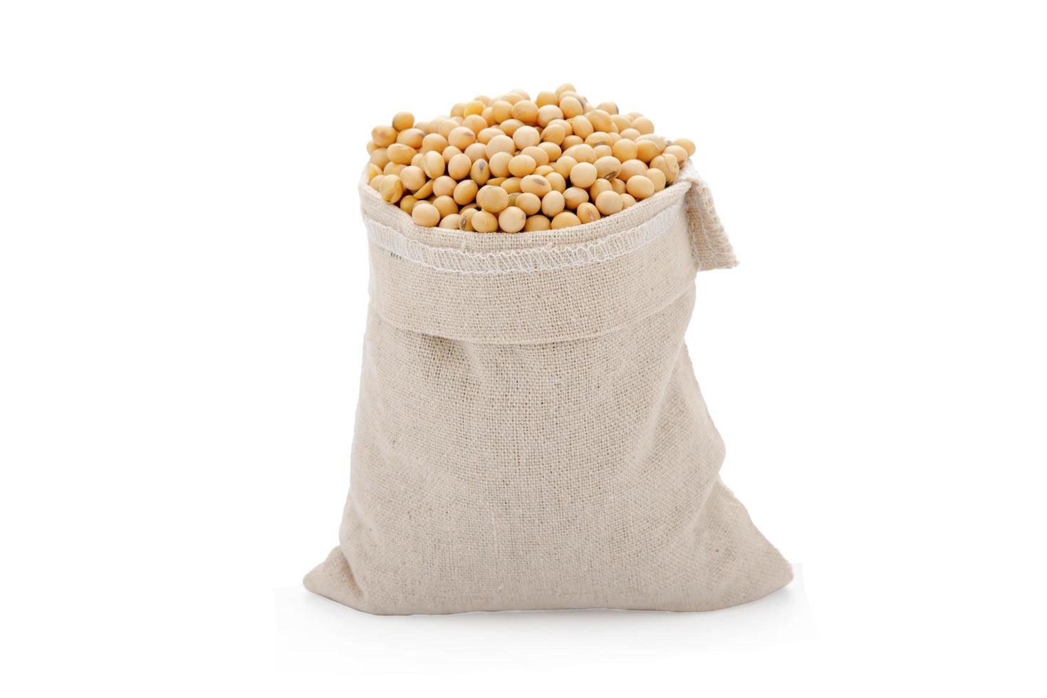 Soybeans in cloth bag isolated on white background with clipping path photo