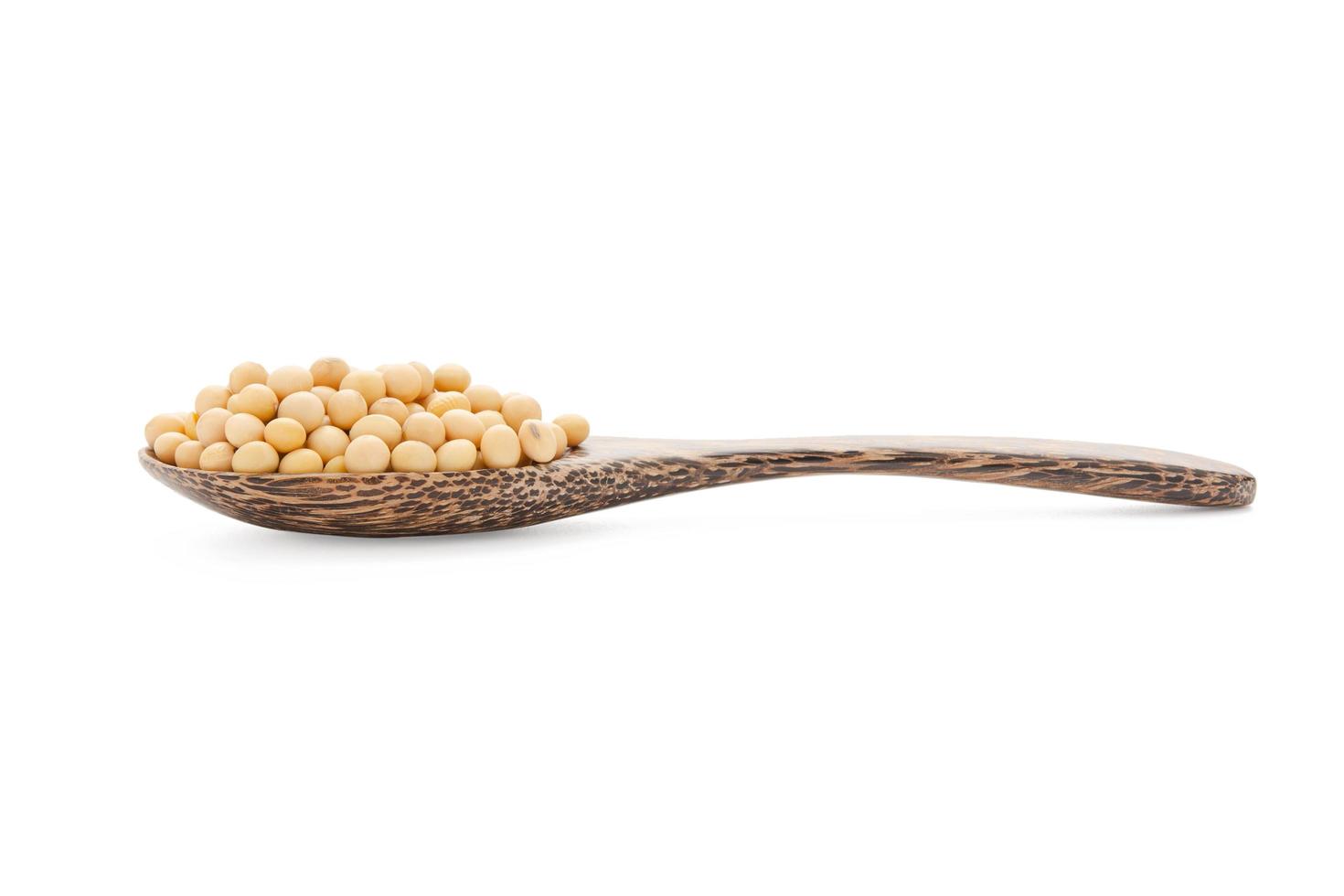 Soybeans in wood spoon isolated on white background with clipping path photo