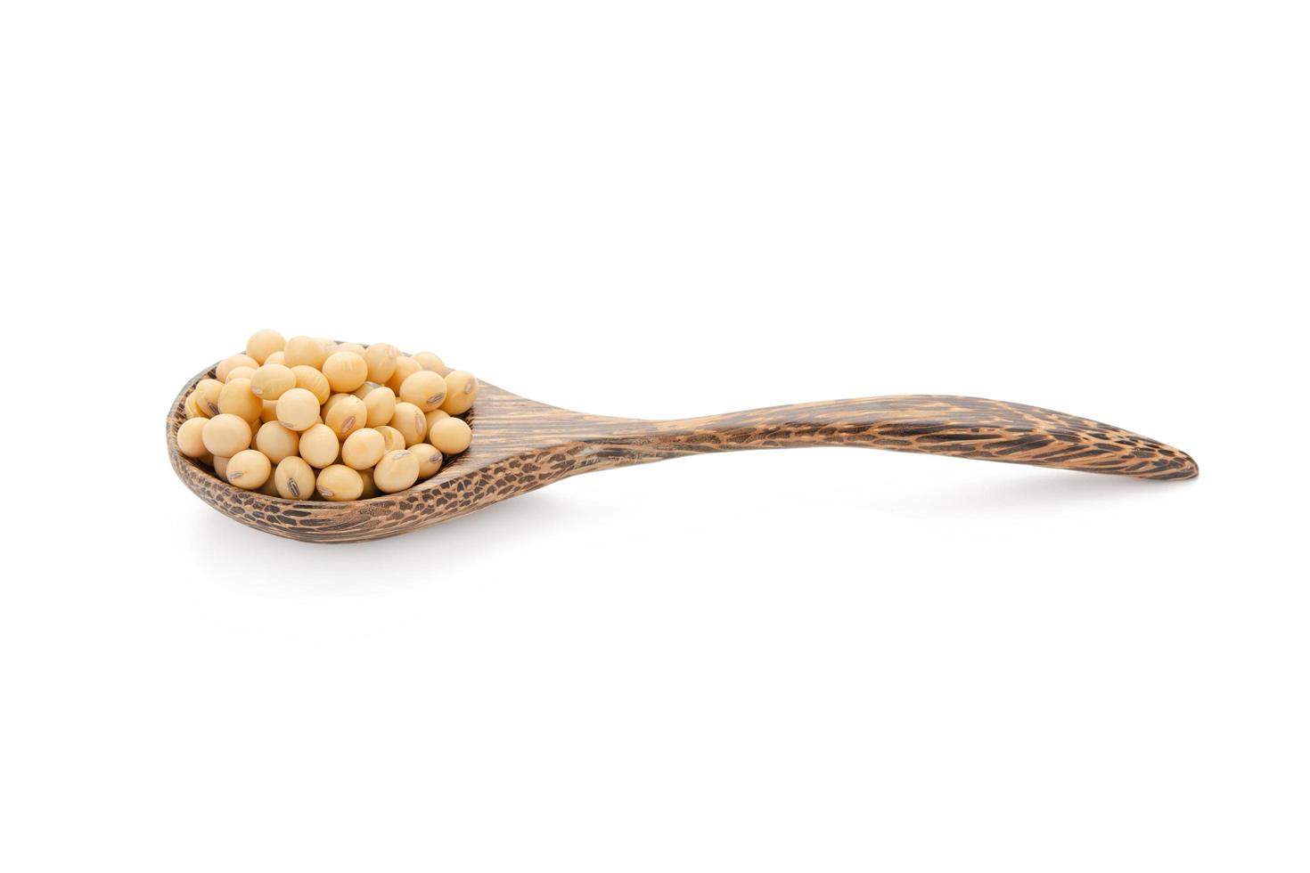 Soybeans in wood spoon isolated on white background with clipping path photo