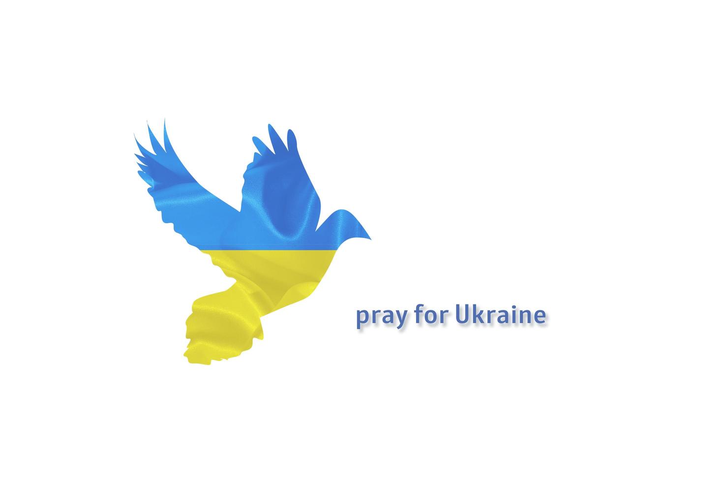 Pray for Ukraine the inscription and silhouette of a dove with a blue and yellow Ukrainian flag photo