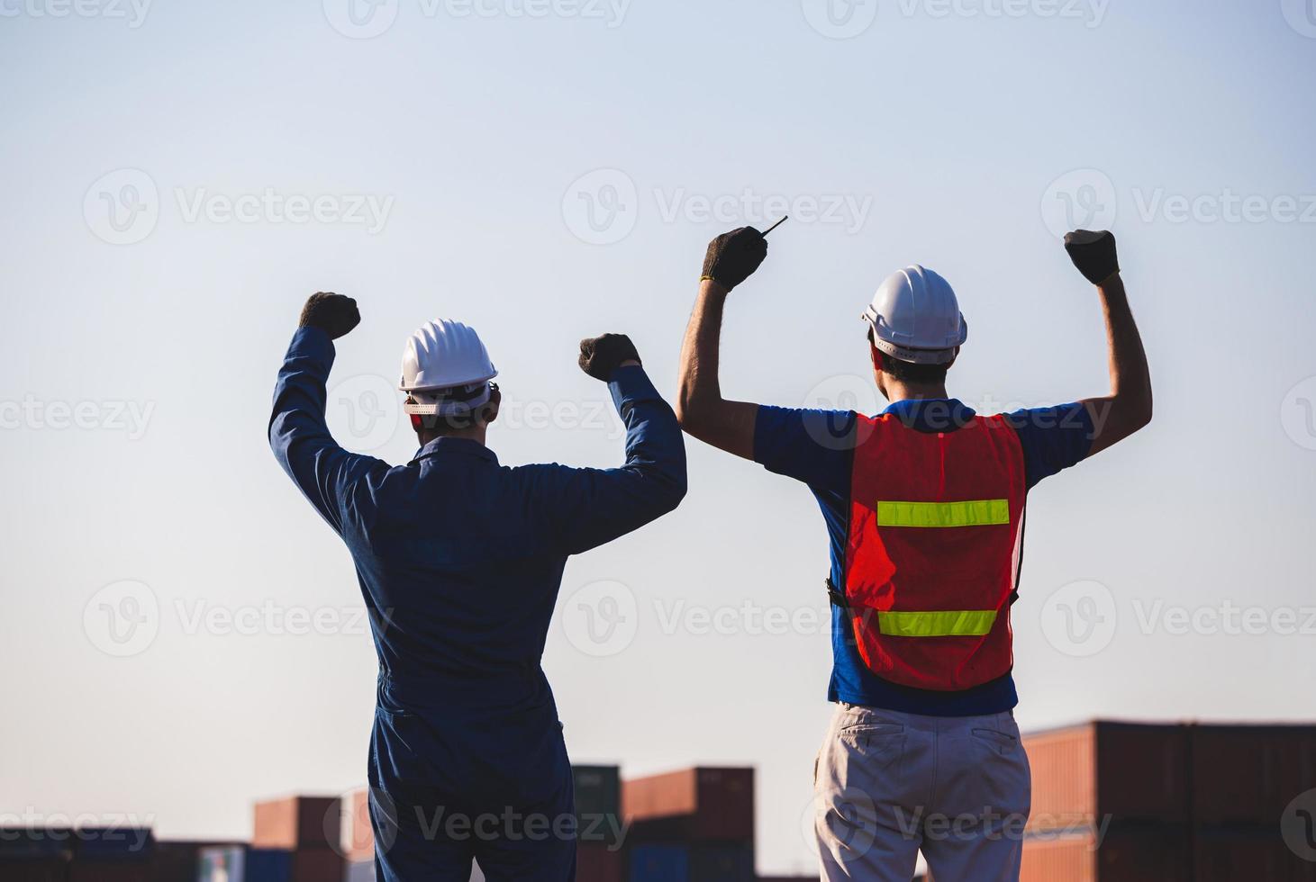 Silhouette of Business engineer man celebration success happiness on container box, Teamwork Concept photo