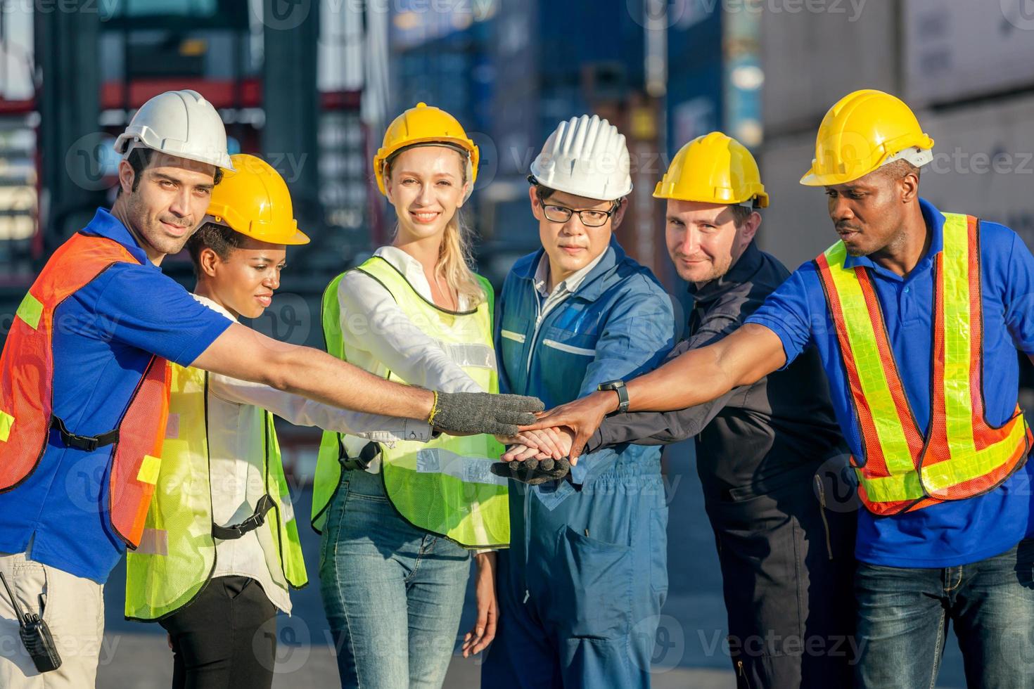 Success Teamwork Concept, Business people engineer and worker team joining hands. photo
