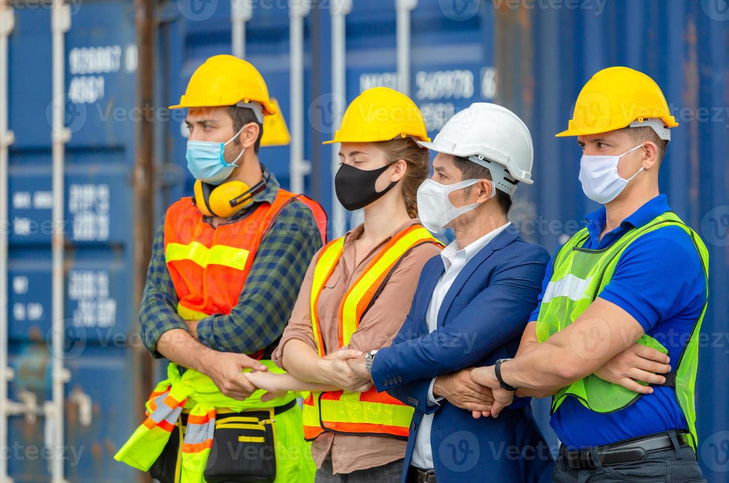 Business people engineer and worker team wearing protection face mask against coronavirus, meeting holding hands together in line, Success and Teamwork Concept photo