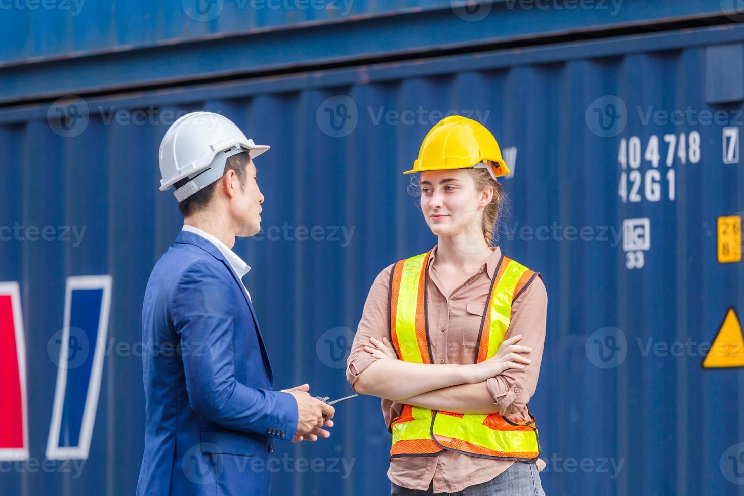Engineer and foreman worker team checking containers box from cargo, Logistic and teamwork concept photo