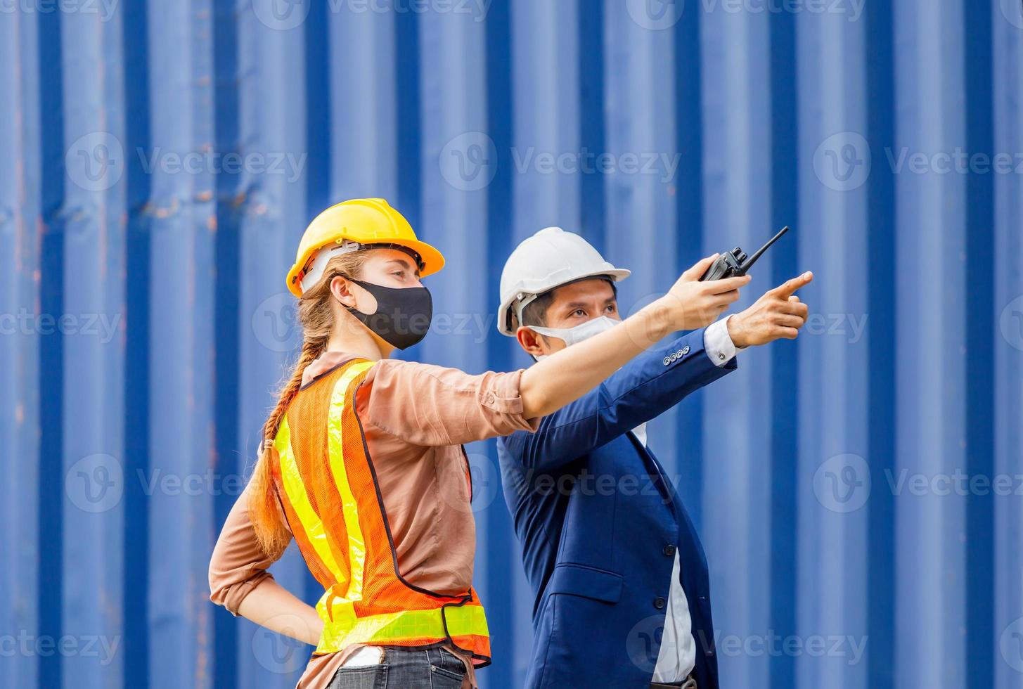 Engineer and worker team checking containers box from cargo, Logistic and teamwork concept photo