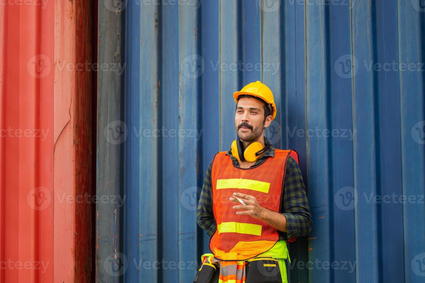 Factory worker with a cigarette smoke break, Labour takes a cigarette break photo