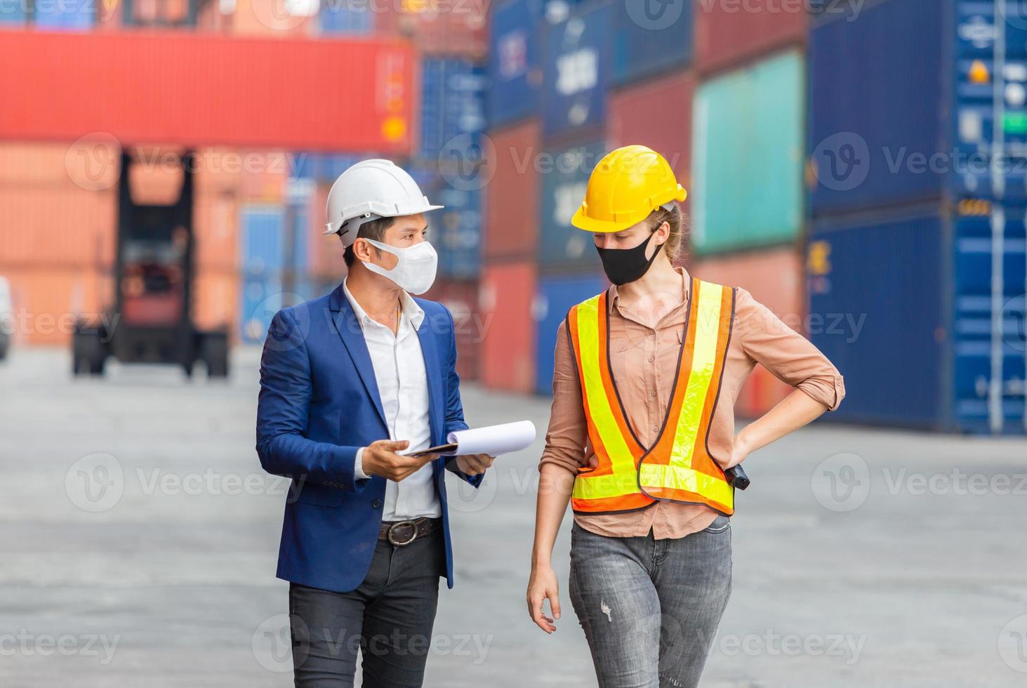 Engineer and worker team checking containers box from cargo, Logistic and teamwork concept photo