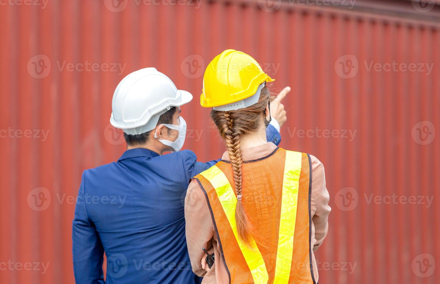Engineer and worker team checking containers box from cargo, Logistic and teamwork concept photo