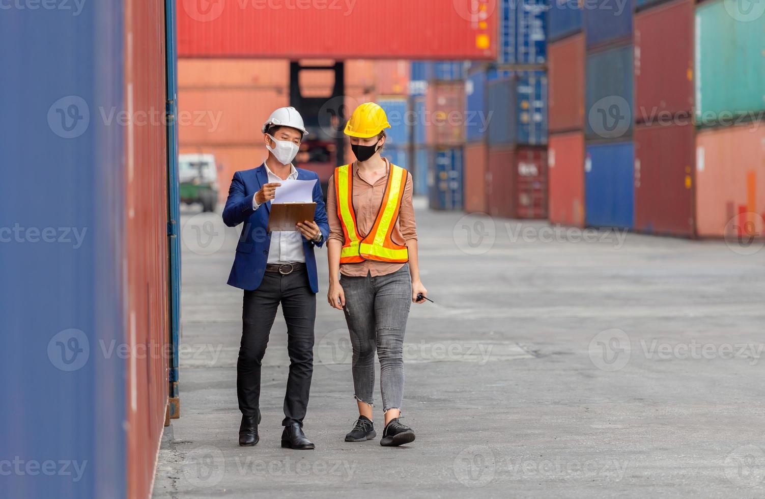 Engineer and worker team checking containers box from cargo, Logistic and teamwork concept photo