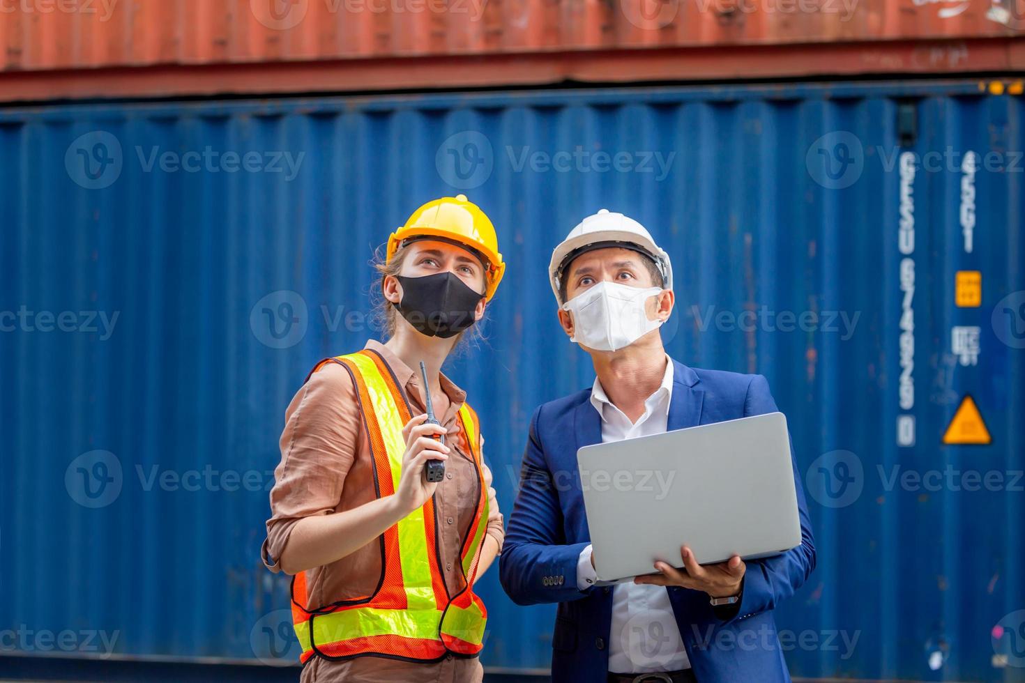 Engineer and worker team checking containers box from cargo, Logistic and teamwork concept photo