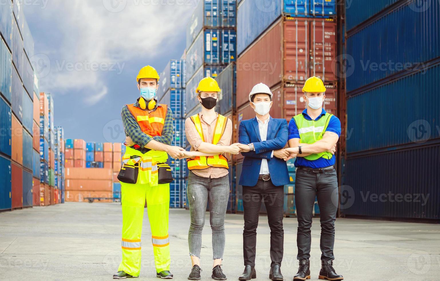 Success Connection and Teamwork Concept, Business people engineer and worker team wearing protection face mask against coronavirus, meeting holding hands together in line photo