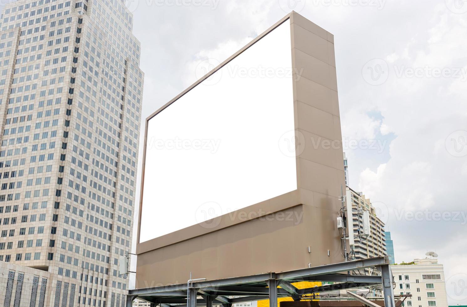 Mockup image of Blank billboard white screen posters with white clouds sky for advertising photo