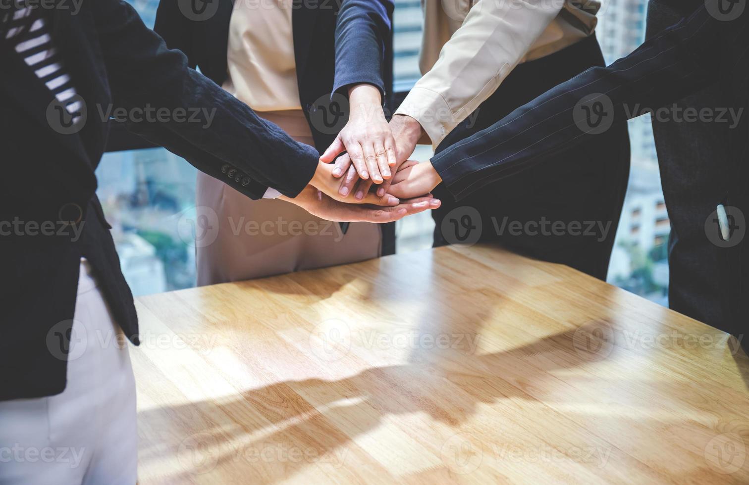 Successful and teamwork concept, Business people team joining hands after meeting in modern office photo