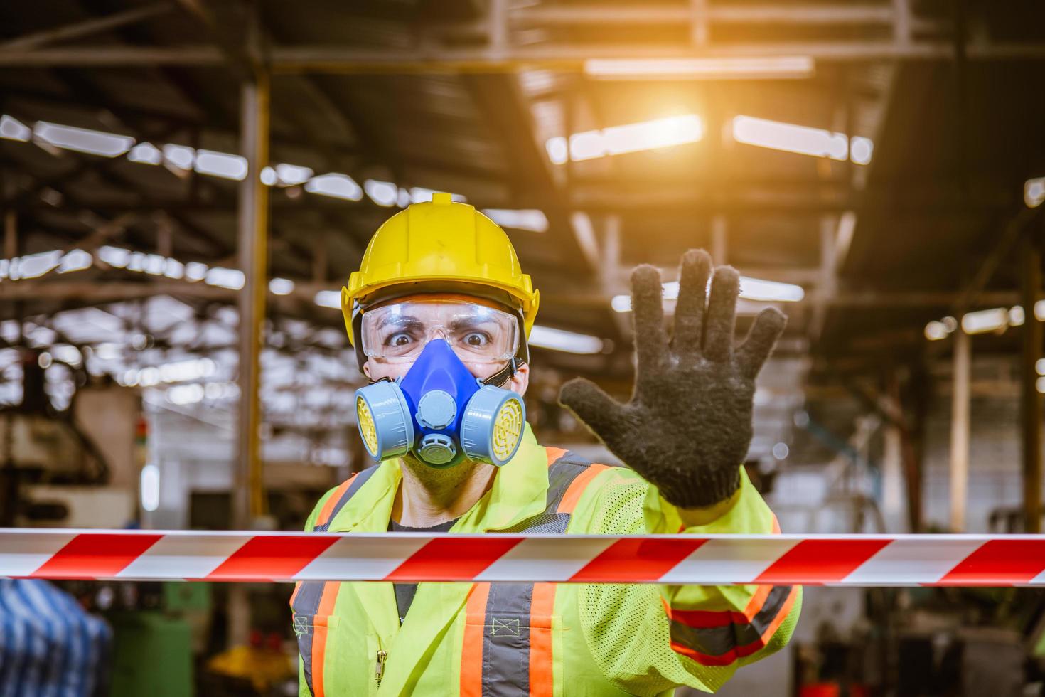 Engineer industry wearing safety uniform ,black gloves ,gas mask feel suffocate when under checking chemical tank in industry factory work. photo