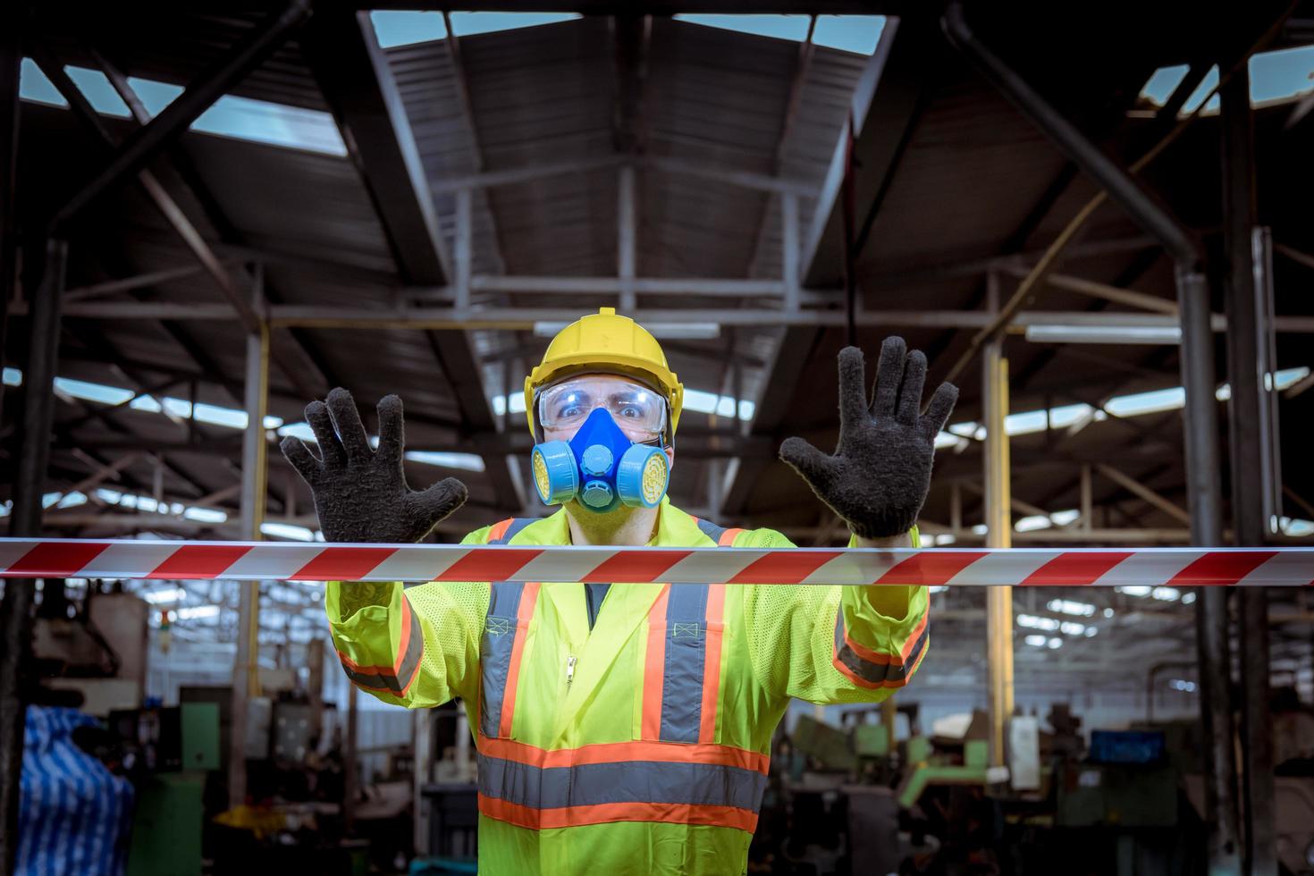 Engineer industry wearing safety uniform ,black gloves ,gas mask feel suffocate when under checking chemical tank in industry factory work. photo