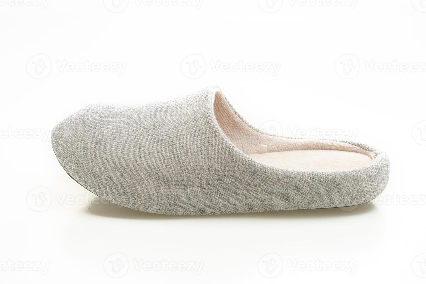 grey slipper on white background photo