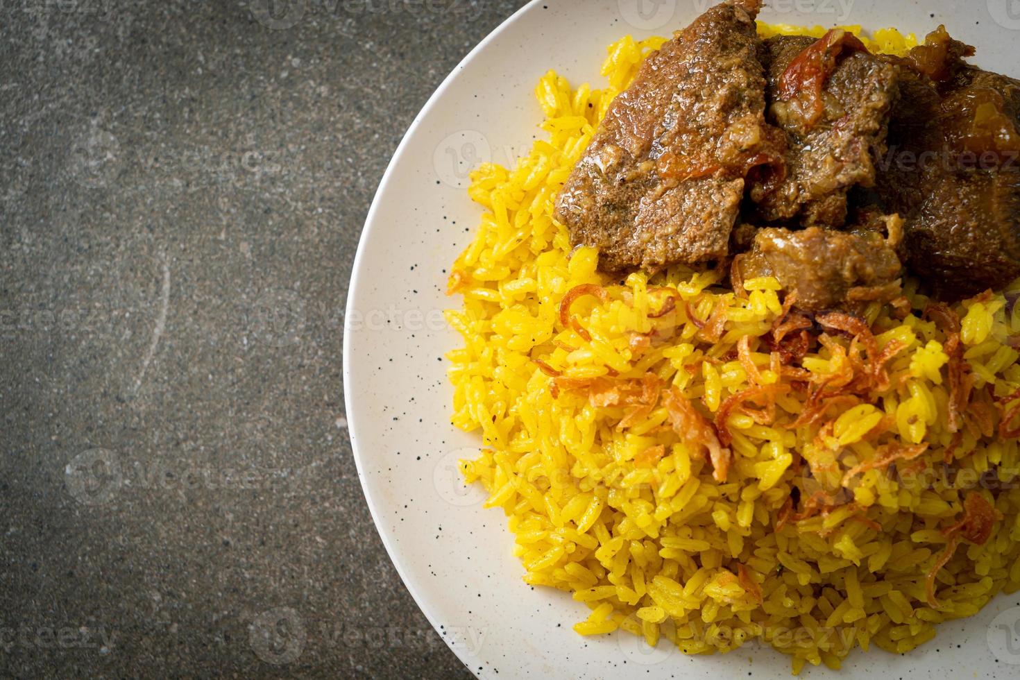 Beef Biryani or Curried rice and beef - Thai-Muslim version of Indian biryani, with fragrant yellow rice and beef photo