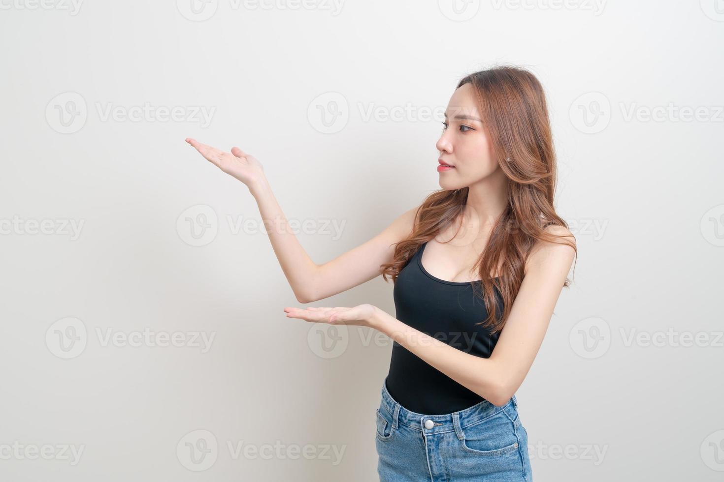 portrait beautiful woman with hand presenting or pointing photo