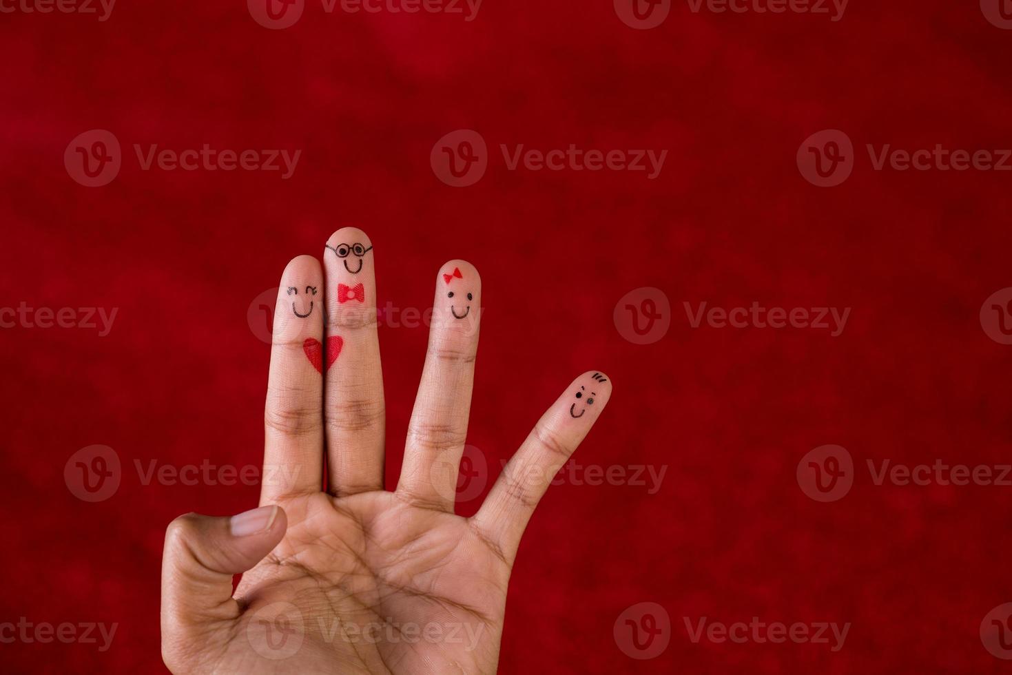 Red background and fingers and cute smile Art concept photo