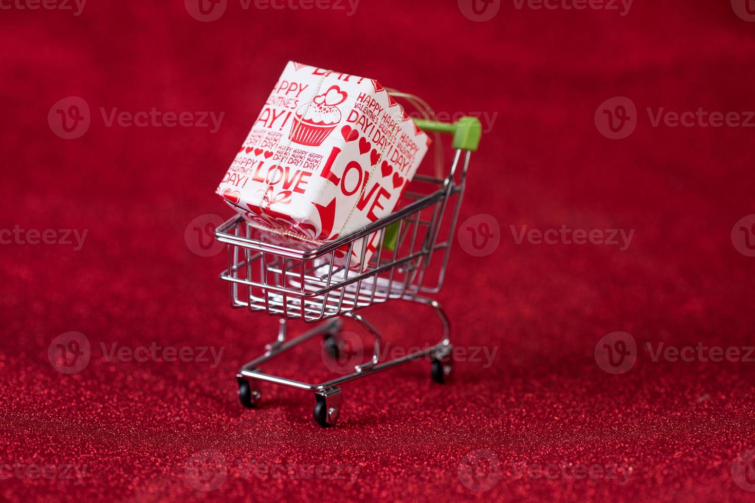 Red background and shopping trolley Shopping concept and trading photo