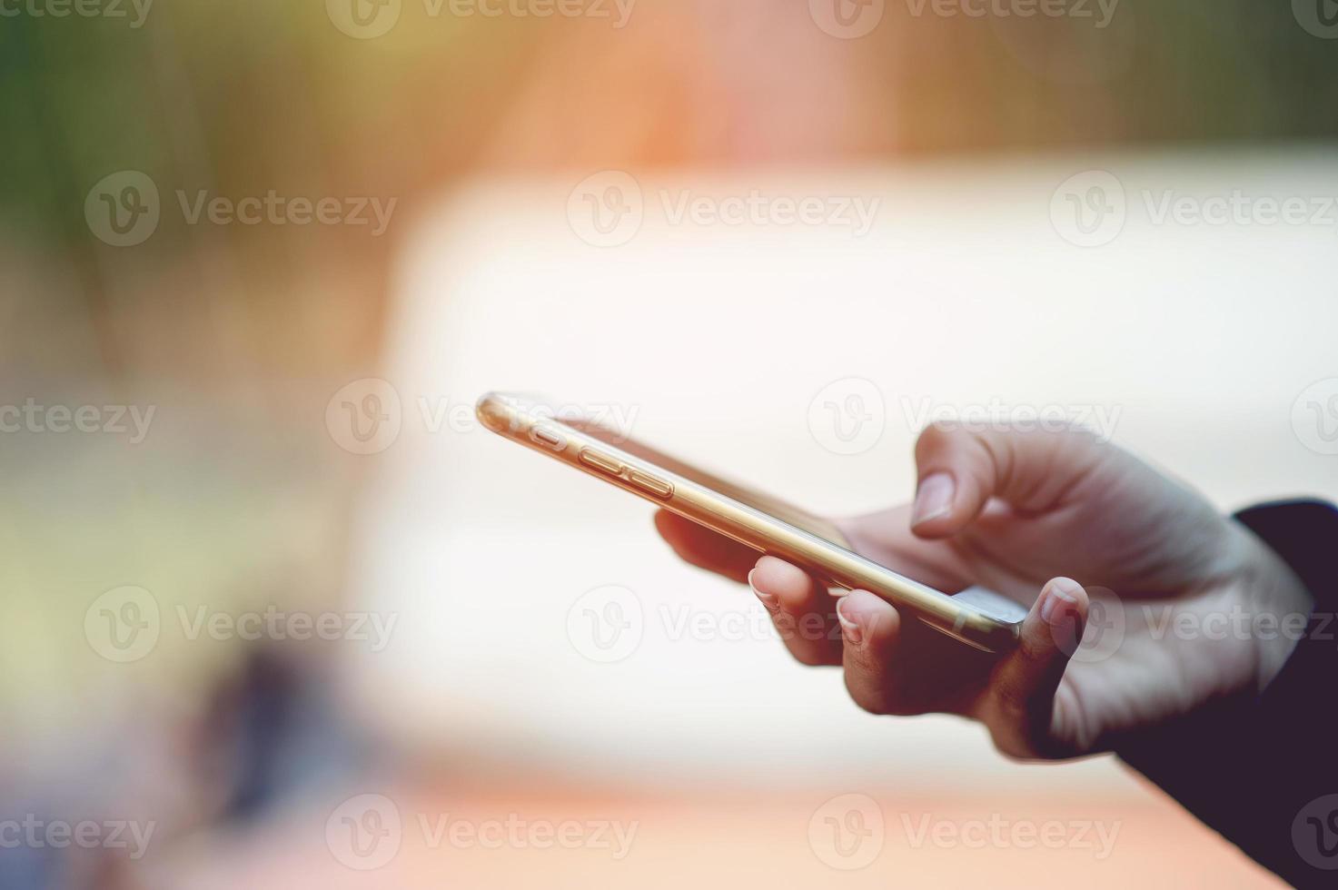 Hands and phones used for online communication Concepts of telephone and technology With copy space photo